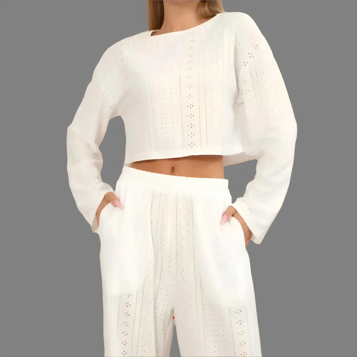 White crochet loungewear set from Casual 2025 Collection, featuring a cropped top and wide-leg pants, perfect for relaxed styling.