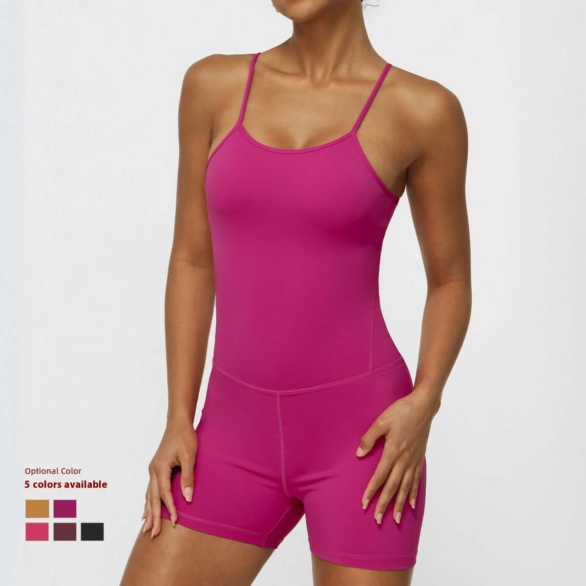 Organic cotton strap sports jumpsuit in pink. Features relaxed fit and breathable material. Available in 5 colors.