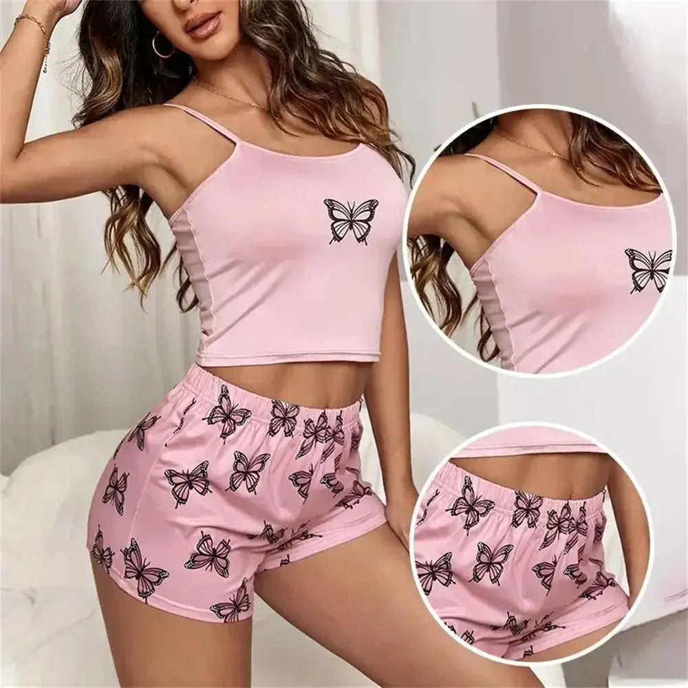 Women's pink loungewear set with butterfly design, made from organic cotton. Features a relaxed fit and breathable material.