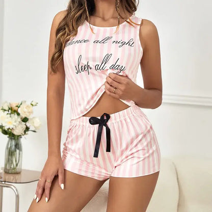 Organic cotton summer pajamas with pink stripes, relaxed fit. Breathable material offers comfort. Perfect for sleep and lounging.