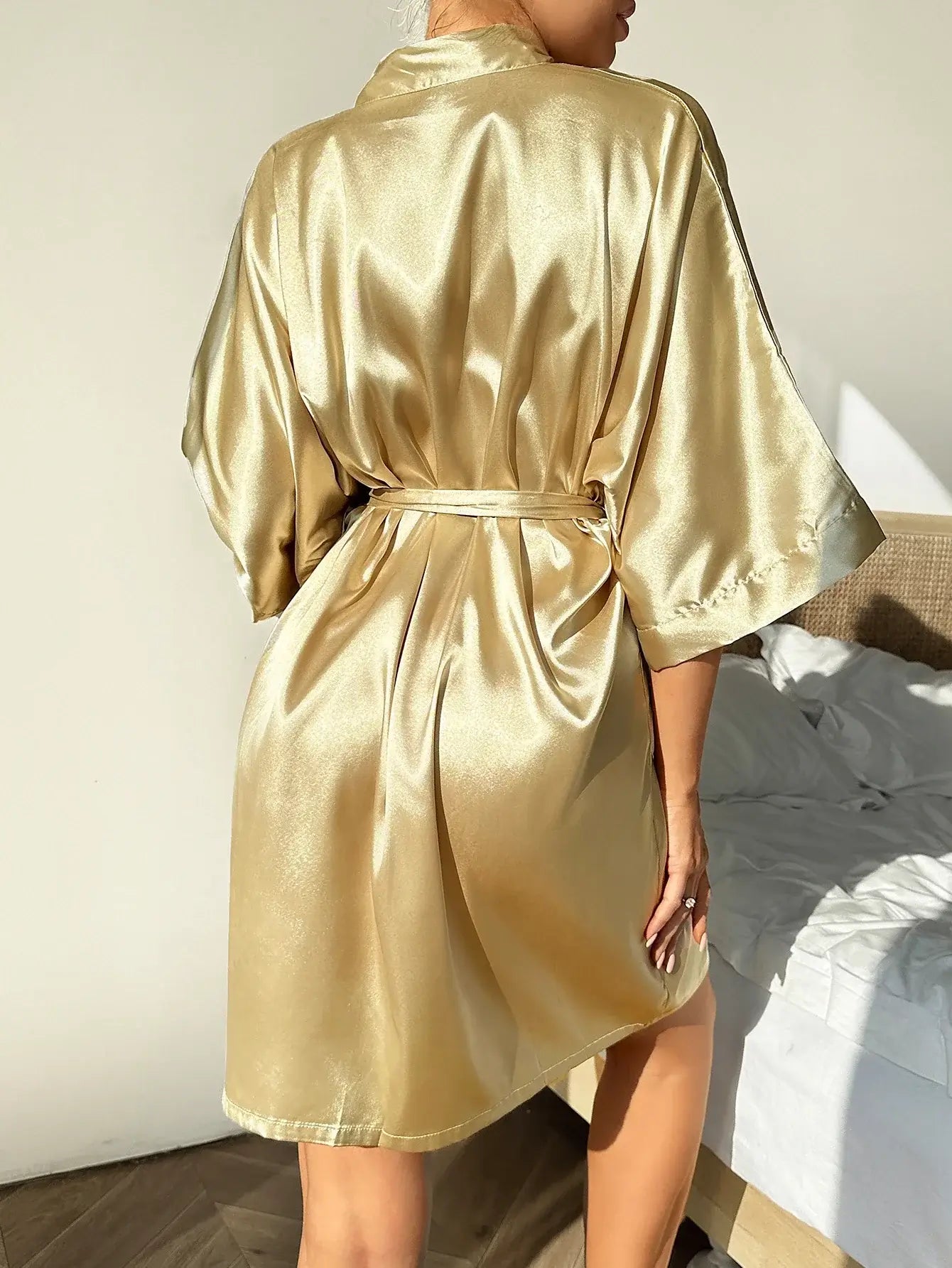 Luxurious gold deluxe kimono nightgown made from organic cotton. Features a relaxed fit and breathable material for comfort.