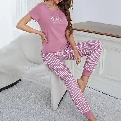 Autumn women's sleepwear in pink. Organic cotton for a relaxed fit. Features breathable material for comfort.