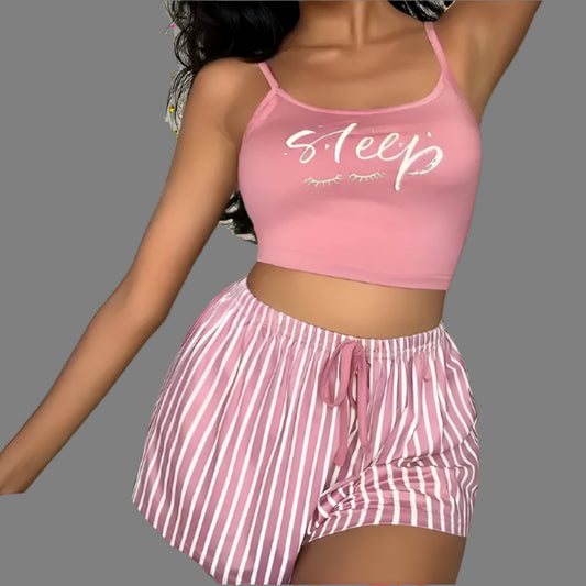 Women’s relaxed fit sleepwear set in organic cotton. Features breathable material. Includes pink top and striped shorts.