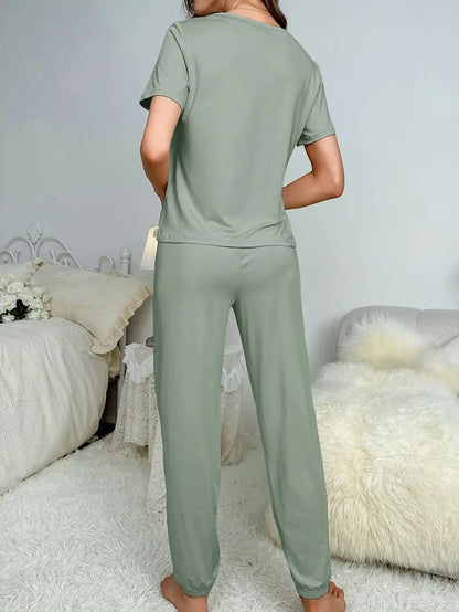 Woman wearing nightly comfort wear in green. Organic cotton, relaxed fit, and breathable material for ultimate comfort.