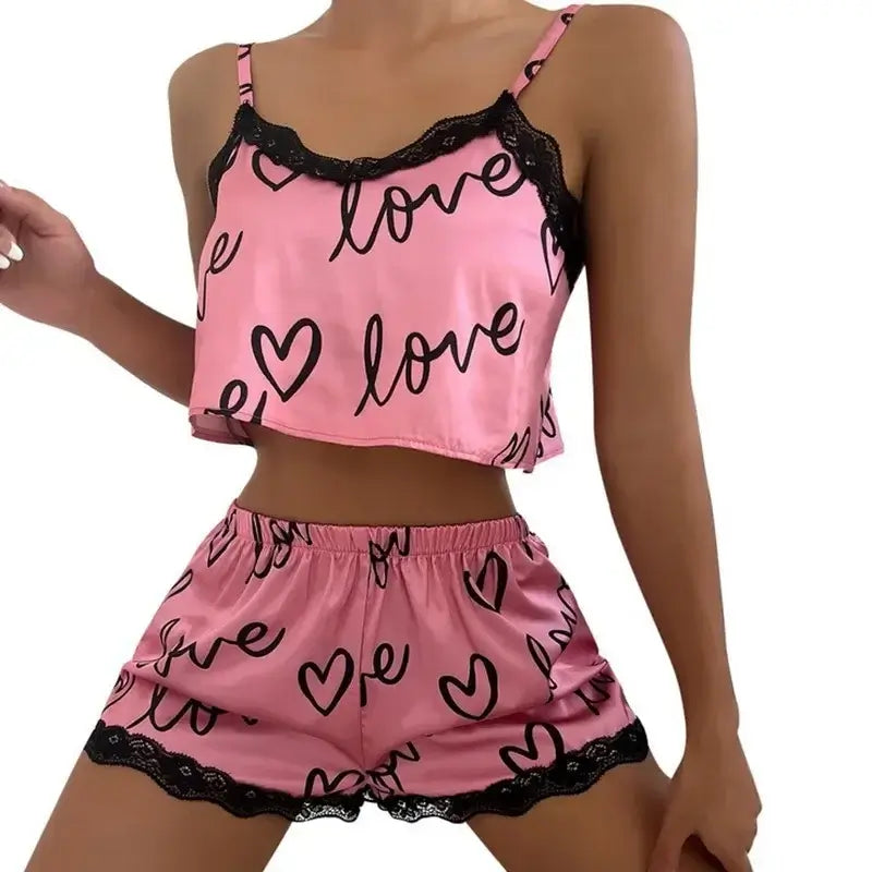 Two-piece pink set with 'love' print. Organic cotton. Relaxed fit, breathable material. Perfect for comfortable wear.