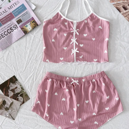 Alt Tag: Organic cotton 2-piece bow sleepwear set in pink, featuring a relaxed fit and breathable material.