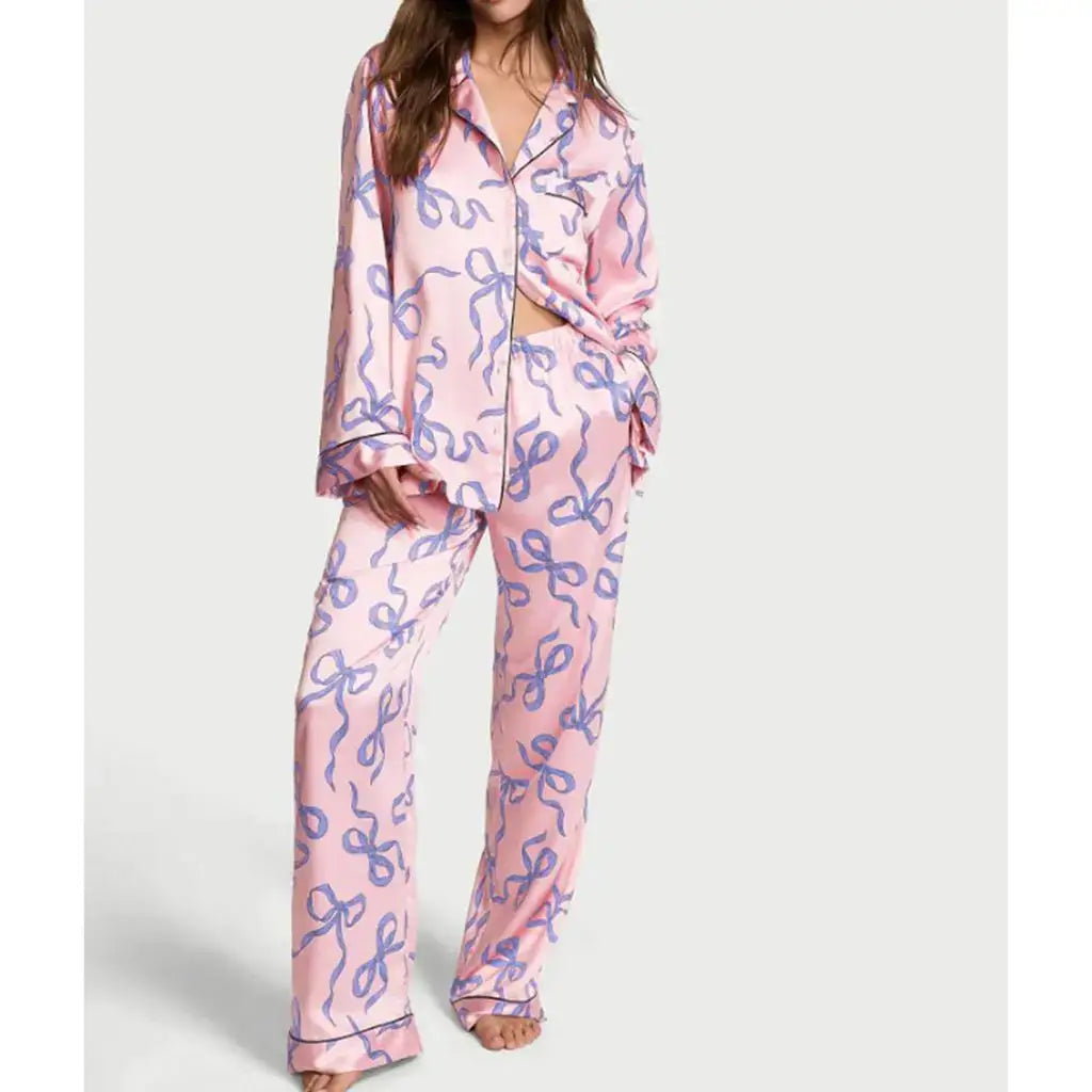 Woman wearing 2Pcs Satin Pajamas in soft print. Made with organic cotton for breathable comfort. Relaxed fit for all-day comfort.