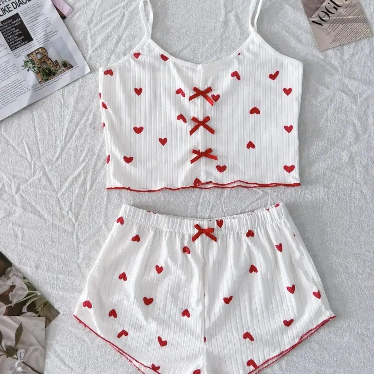 Organic cotton bow sleepwear set, relaxed fit, breathable material.