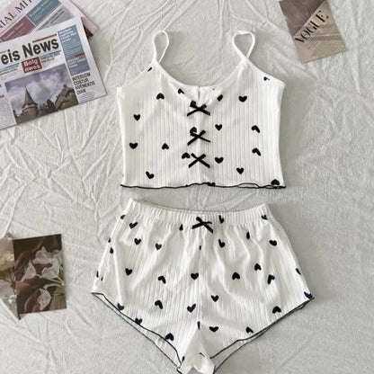 2-piece bow sleepwear set in organic cotton. Features a relaxed fit and breathable material. Perfect for comfortable sleep.