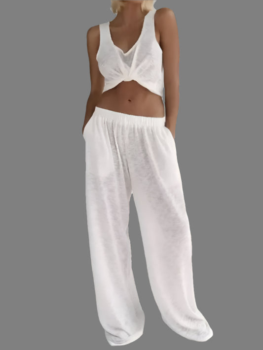 Organic cotton sleeveless pajama set with relaxed fit. Breathable material tank and pants. Perfect for lounging.