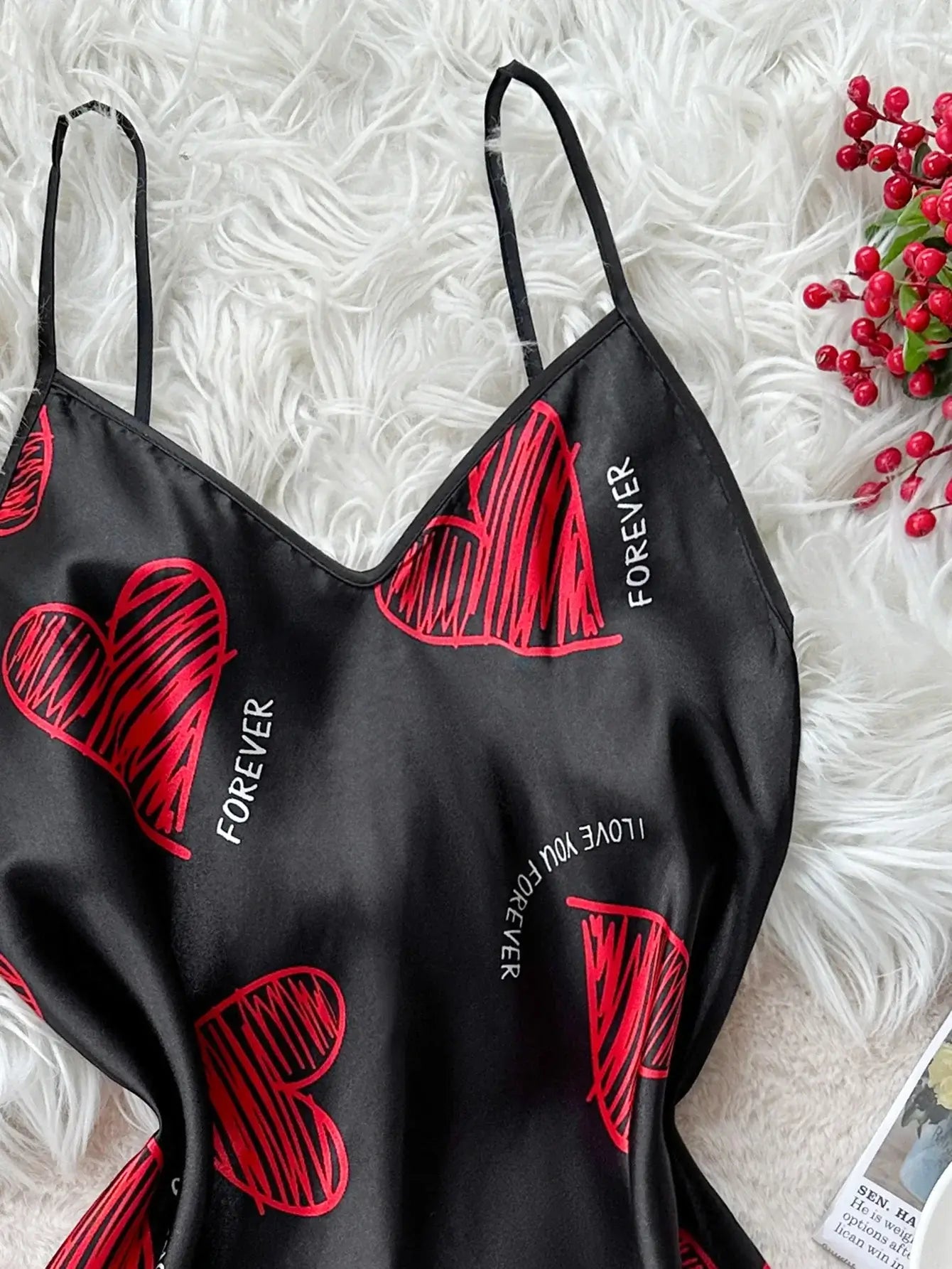 Red lip print satin slip made from organic cotton, featuring a relaxed fit. Perfect for staying cool with breathable material.