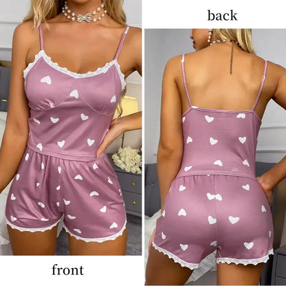 Pink two-piece set with heart patterns, front and back view. Made from organic cotton, relaxed fit, and breathable material.