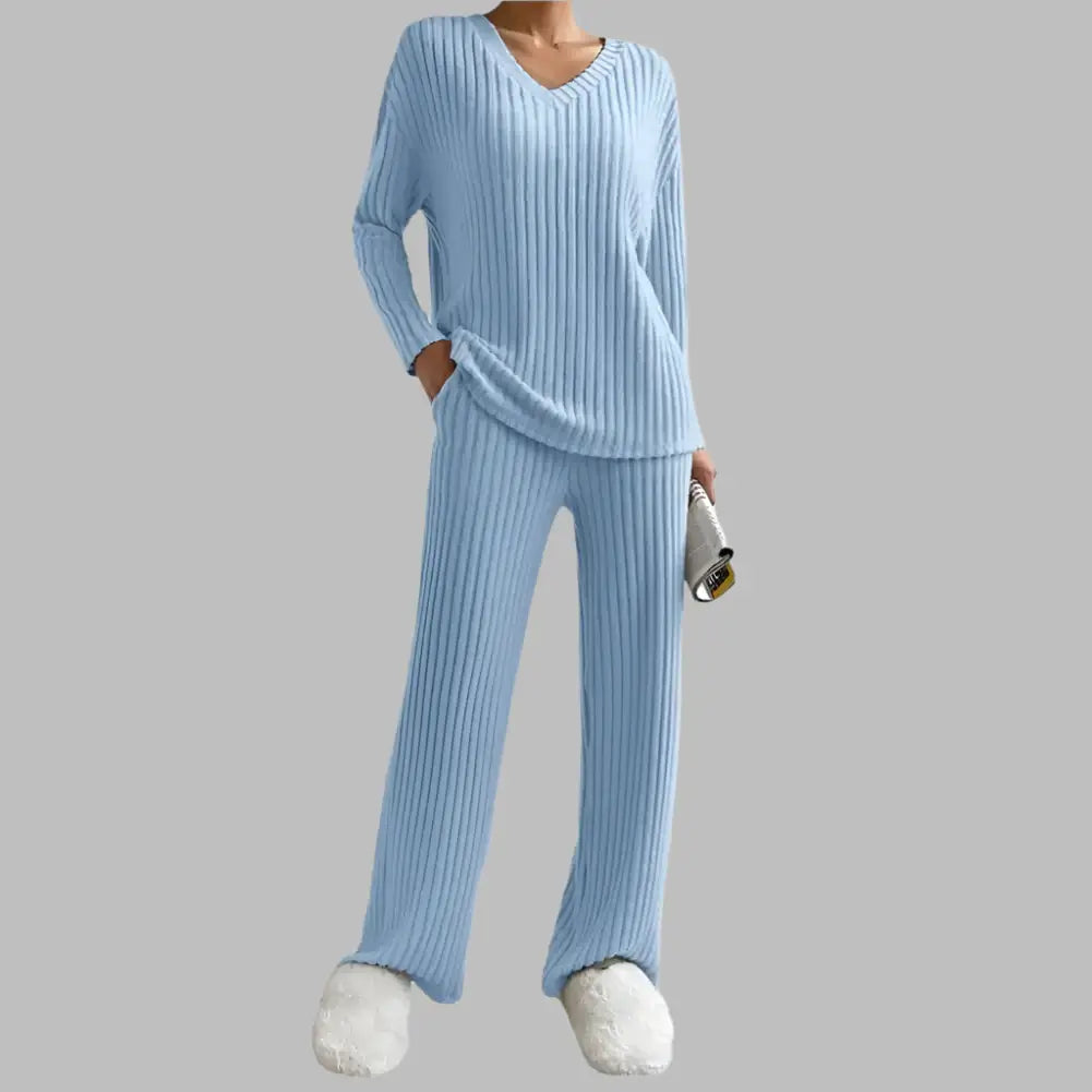 Knitted lounge set pajamas in blue. Made from organic cotton. Features a relaxed fit and breathable material for comfort.