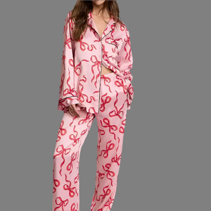 Satin pajamas with red ribbon pattern, organic cotton, relaxed fit, breathable material for comfort and style.