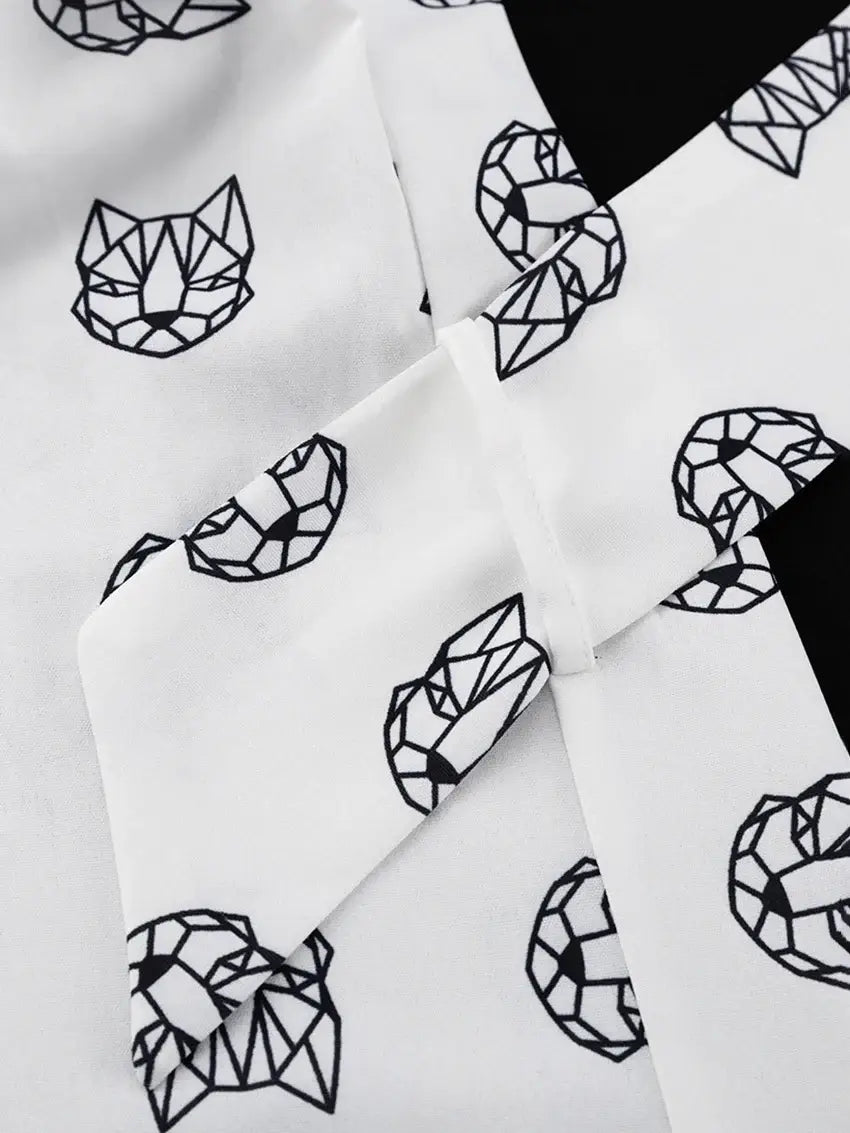 Geometric cat design on organic cotton fabric, relaxed fit, breathable material.