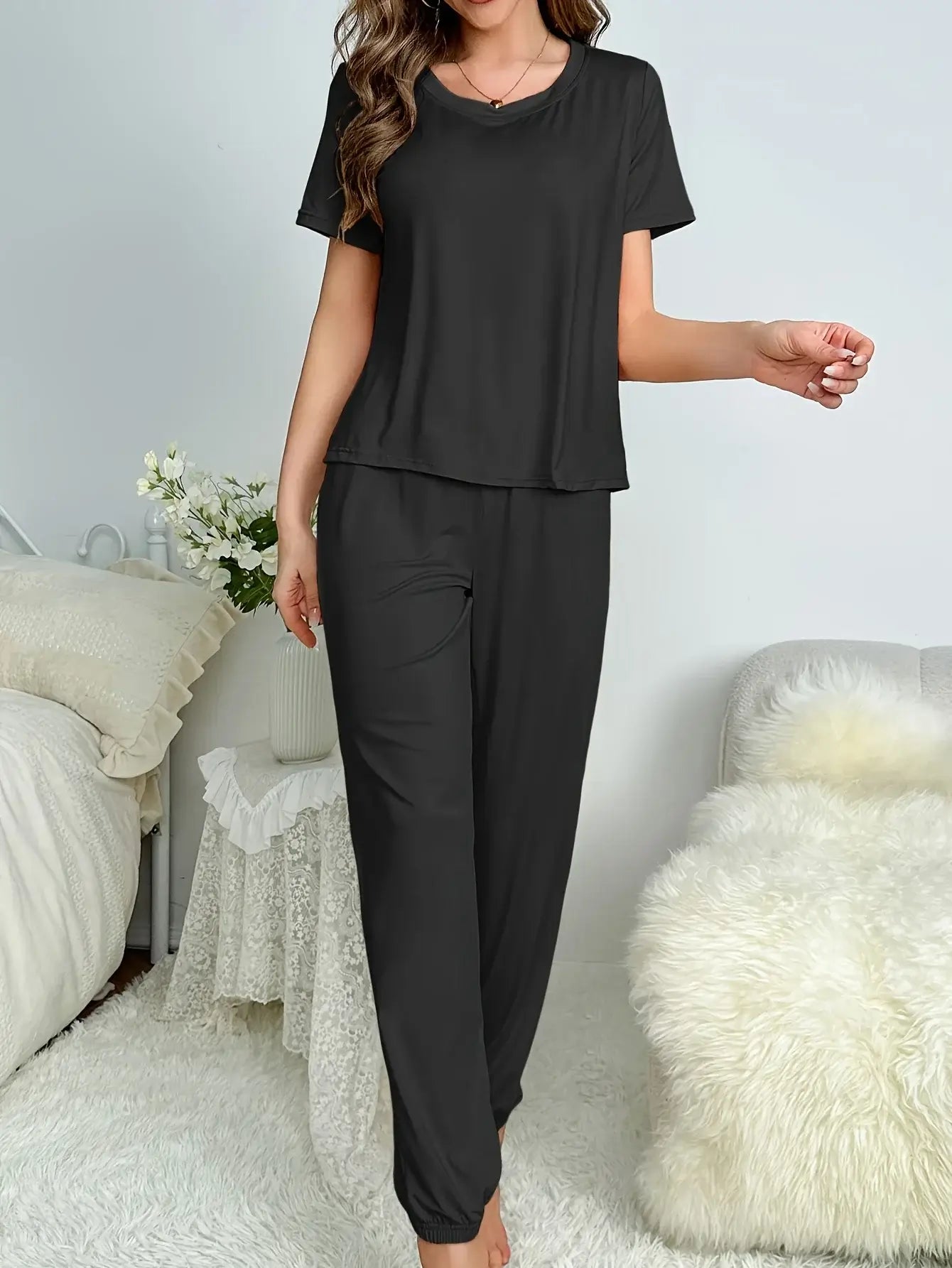 Woman wearing Nightly Comfort Wear made of organic cotton, featuring a relaxed fit and breathable material.