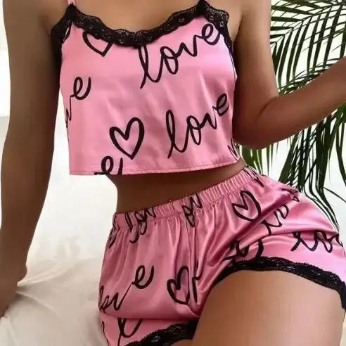 Organic cotton two-piece set with relaxed fit and breathable material, featuring pink love design for comfortable wear.