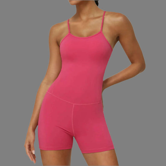 Strap sports jumpsuit in pink. Made from organic cotton. Features relaxed fit and breathable material.