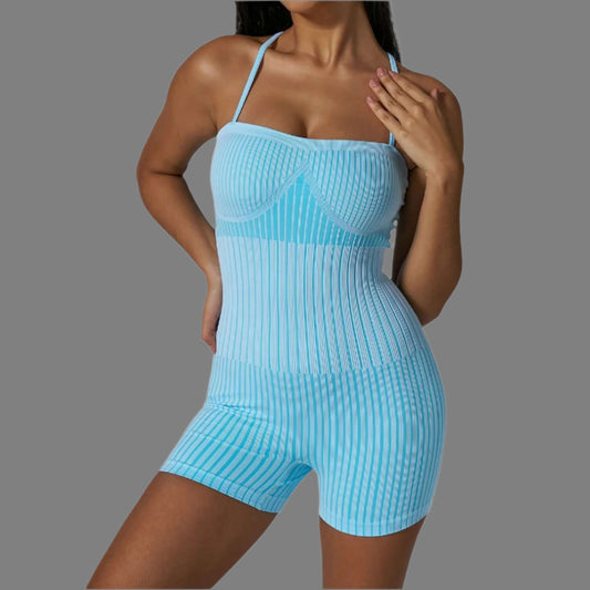 Ribbed strappy bodysuit in blue. Made from organic cotton. Offers a relaxed fit. Features breathable material for comfort.