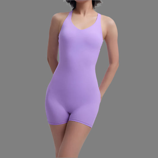 Woman wearing a purple fitness bodysuit. Organic cotton, relaxed fit, breathable material.